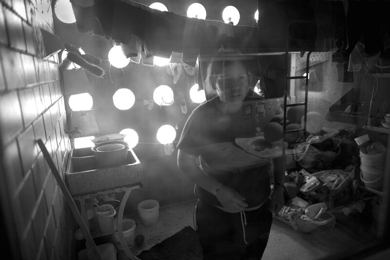 Woman in Cluttered Room — Black