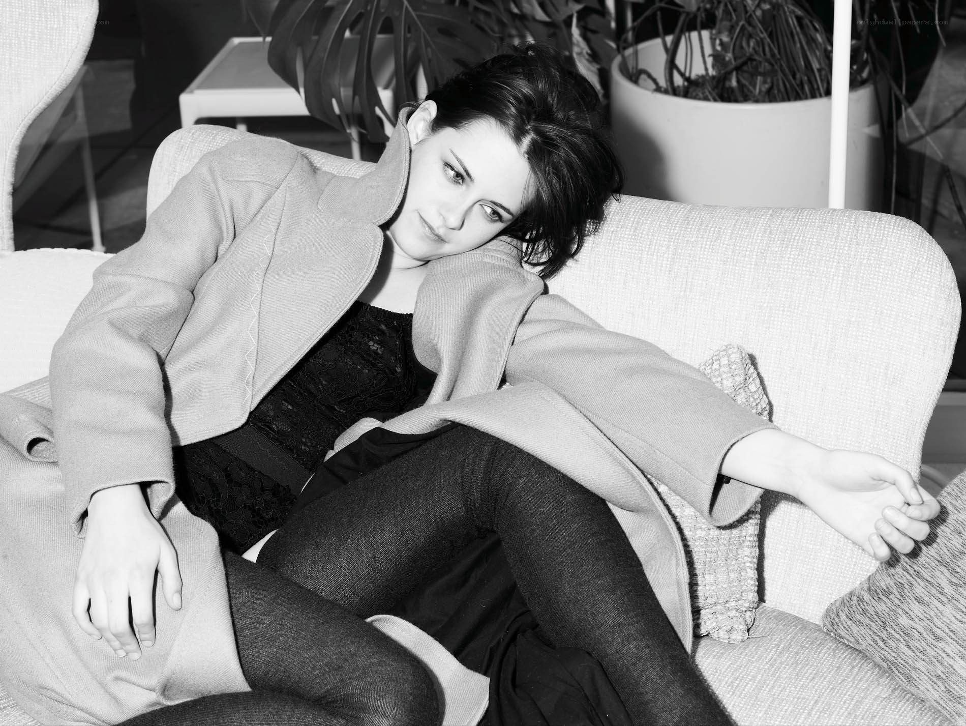 woman in coat on couch