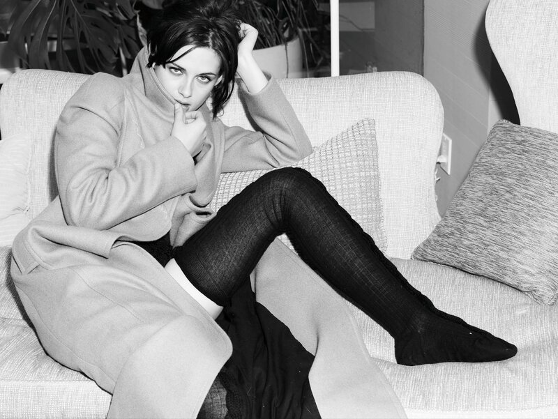 woman in coat on couch