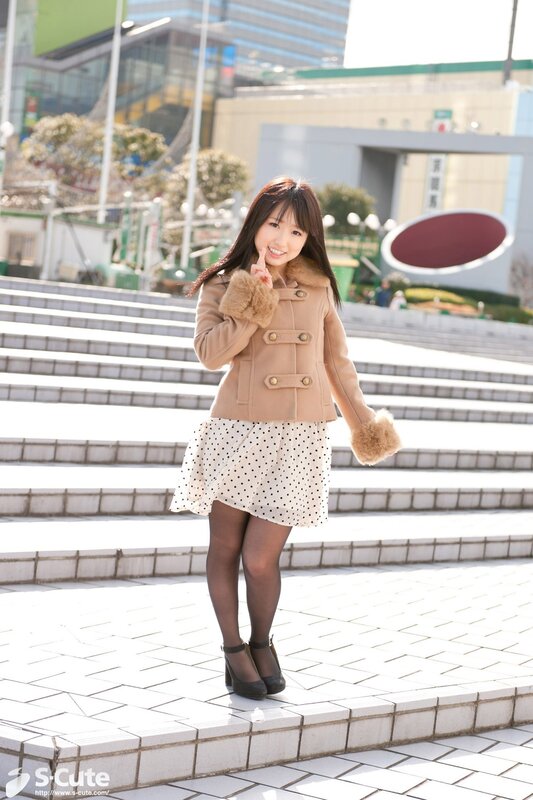 Woman in coat on steps