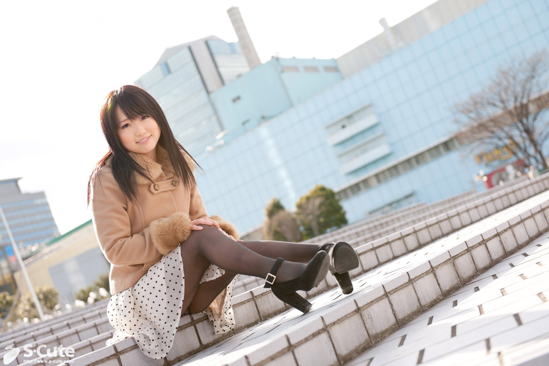 Woman in coat on steps
