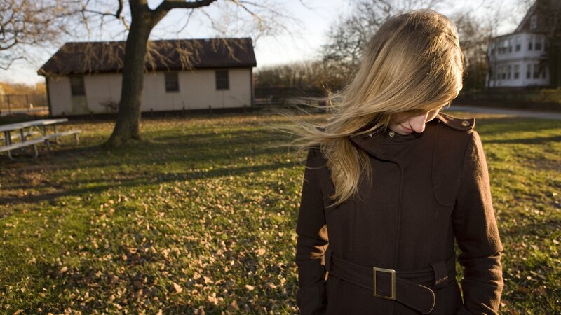 Woman in coat outdoors