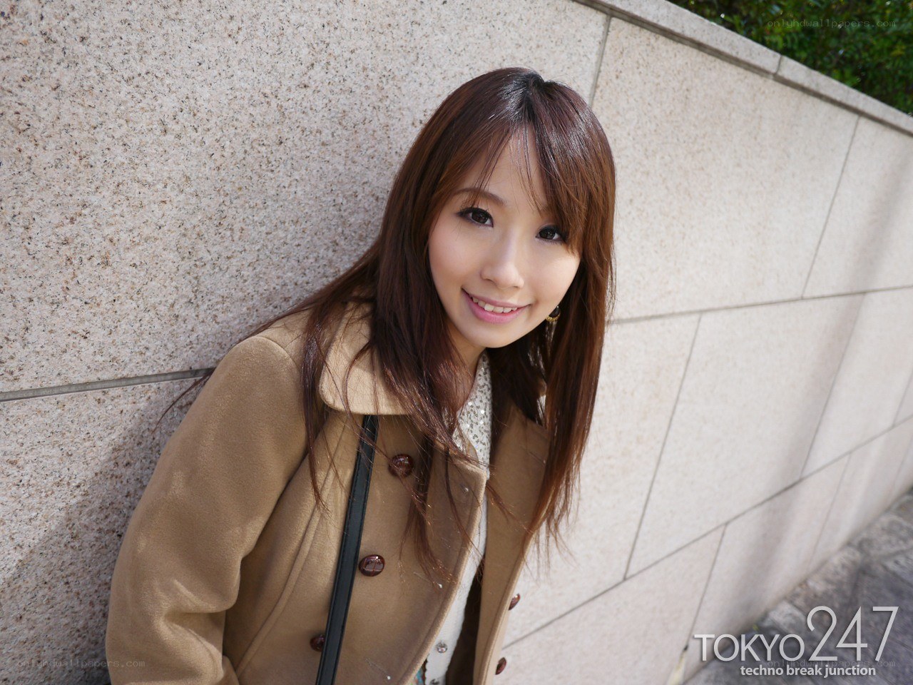 woman in coat smiling