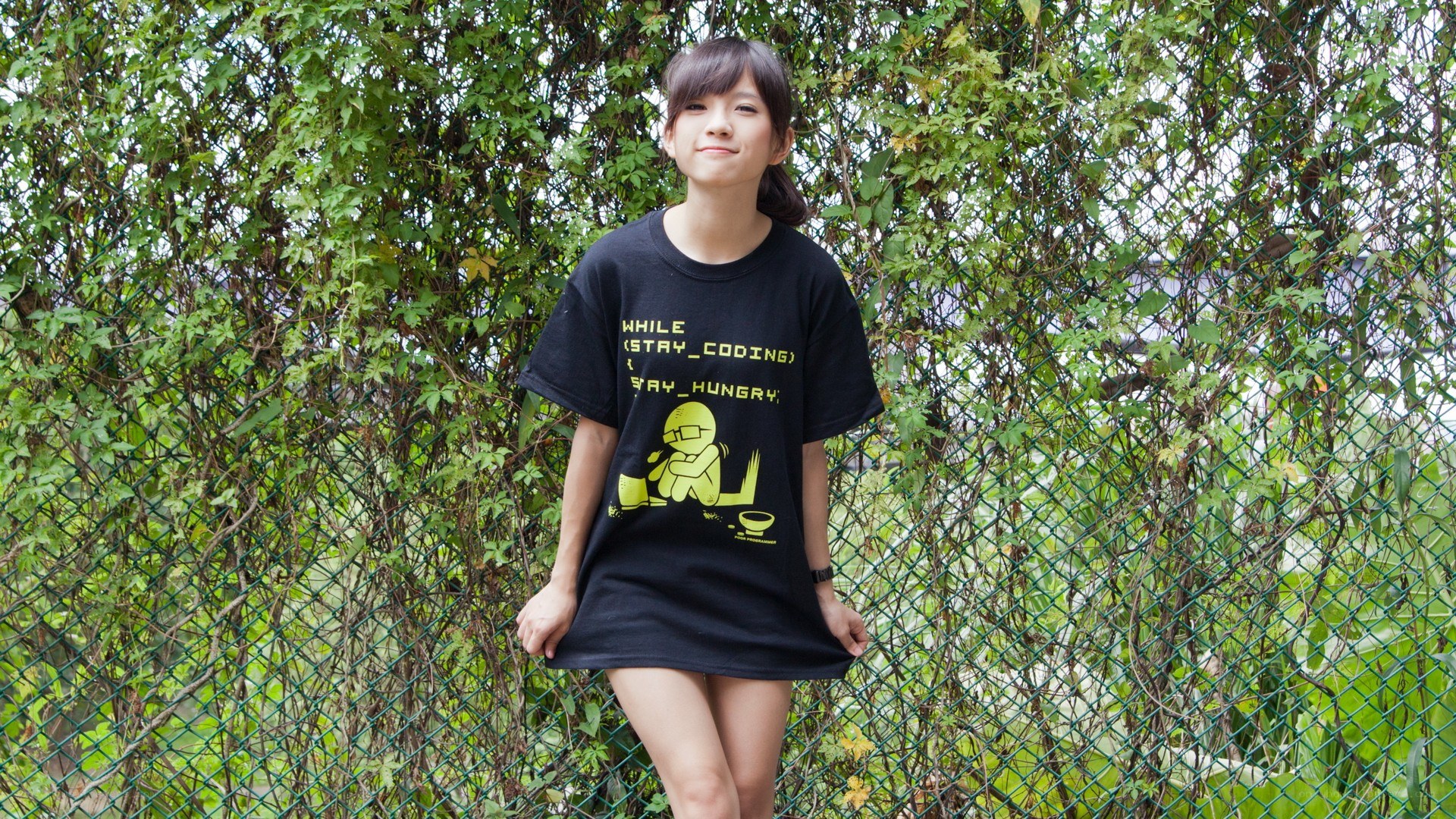 Woman in coding t-shirt