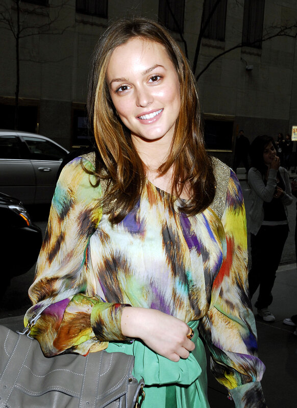 woman in colorful blouse smiling