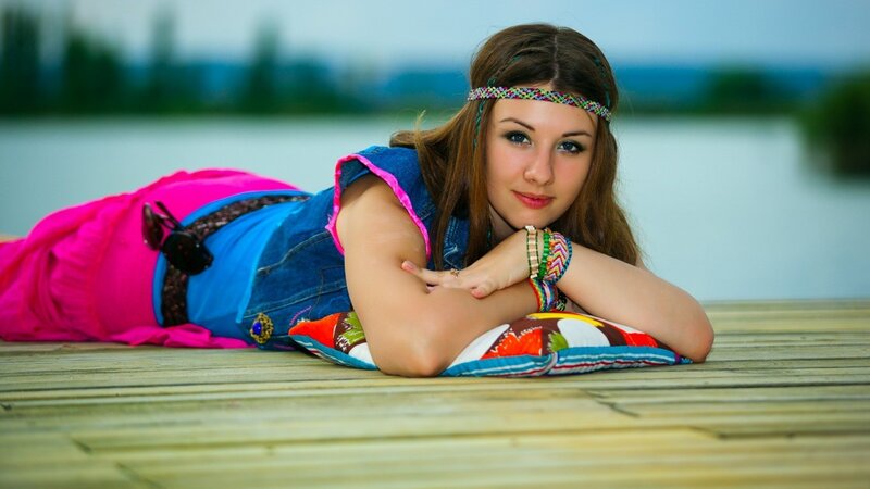 woman in colorful clothes on dock