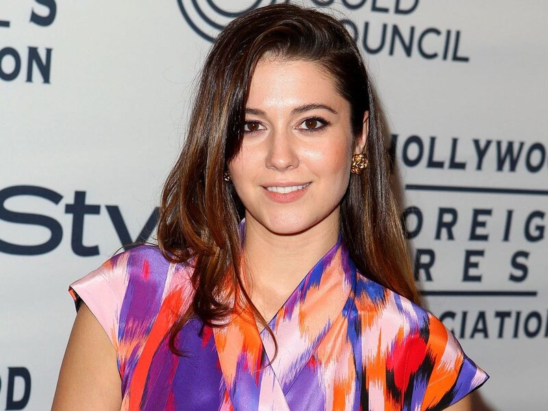 woman in colorful dress at event