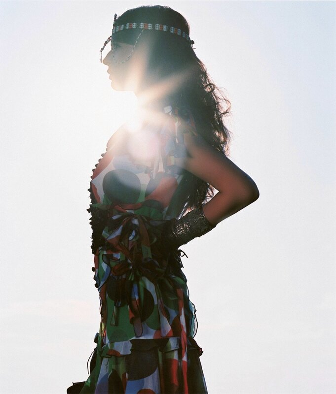 woman in colorful dress at sunset