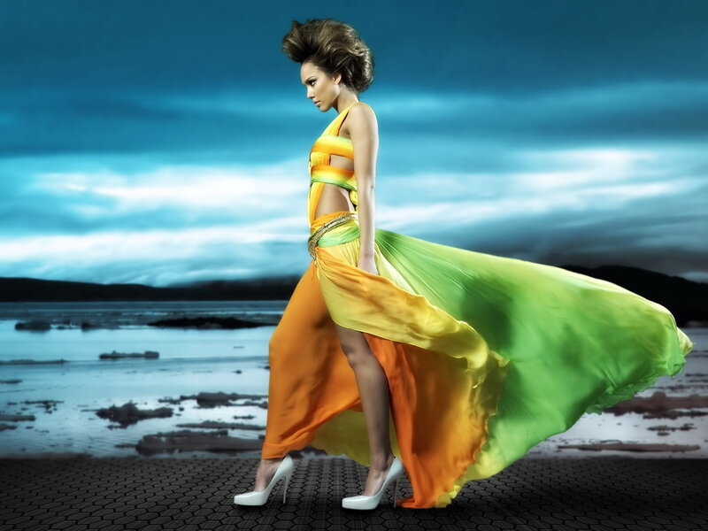 Woman in colorful dress on beach