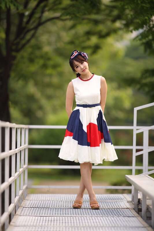 woman in colorful dress on bridge