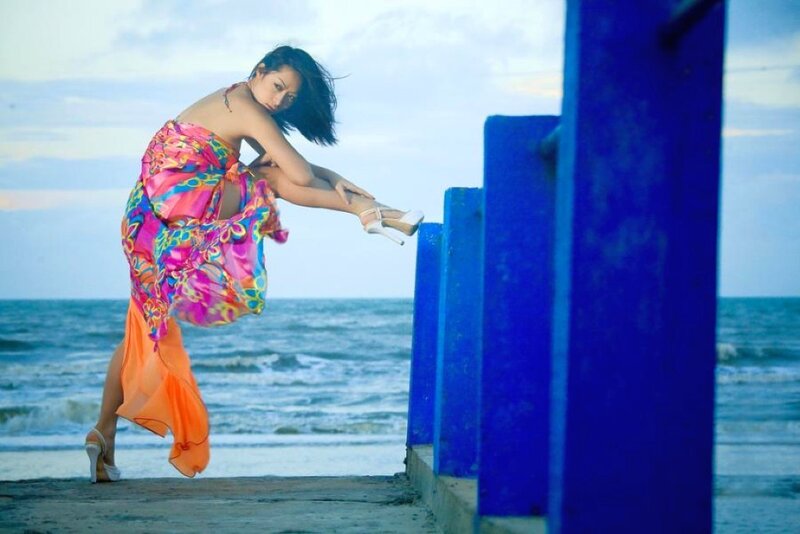 woman in colorful dress on pier