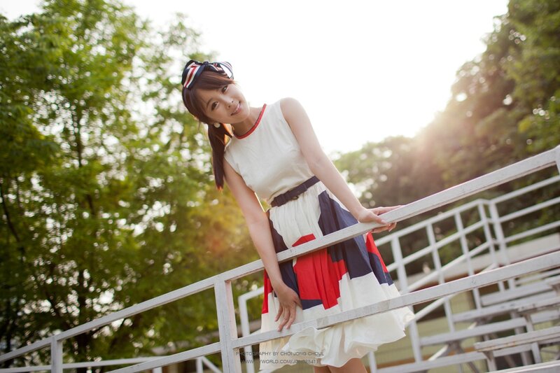 woman in colorful dress on stairs