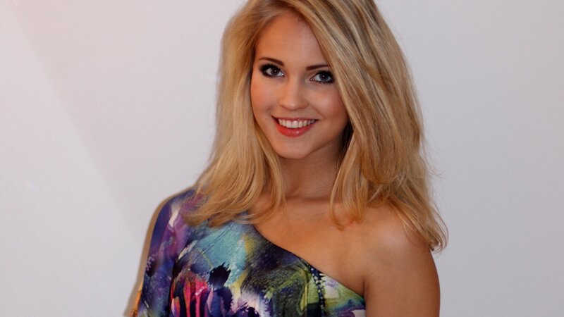 woman in colorful dress smiling