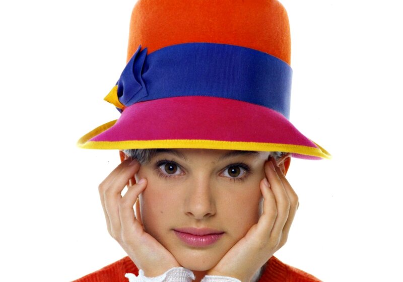 Woman in Colorful Hat — Orange