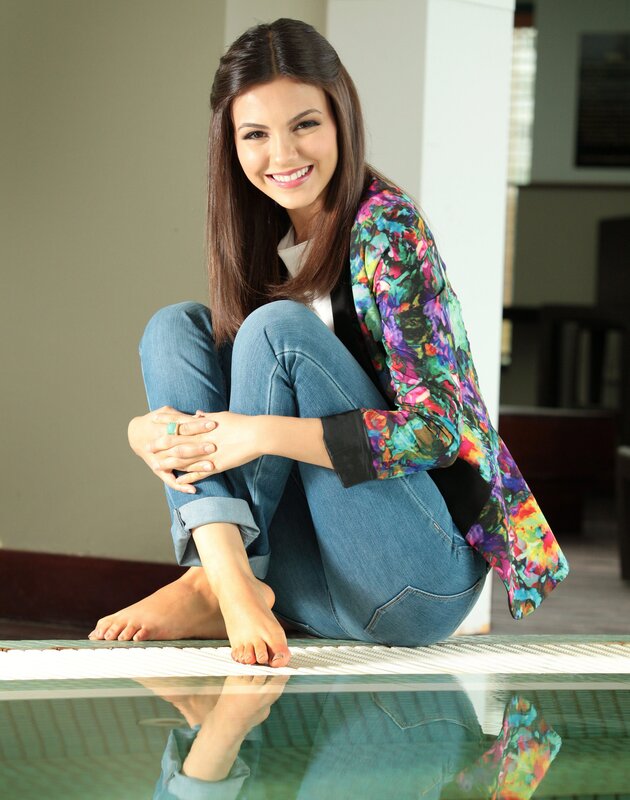 woman in colorful jacket sitting