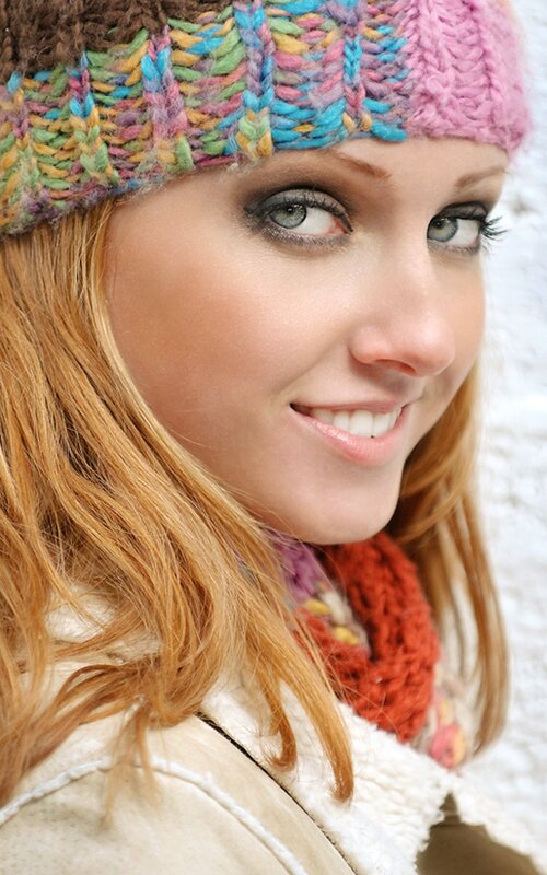 woman in colorful knit hat
