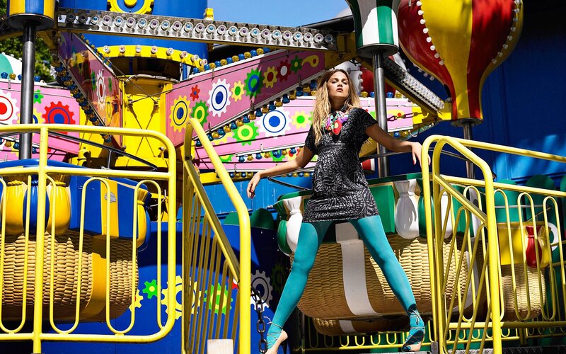 Woman in colorful outfit at amusement park