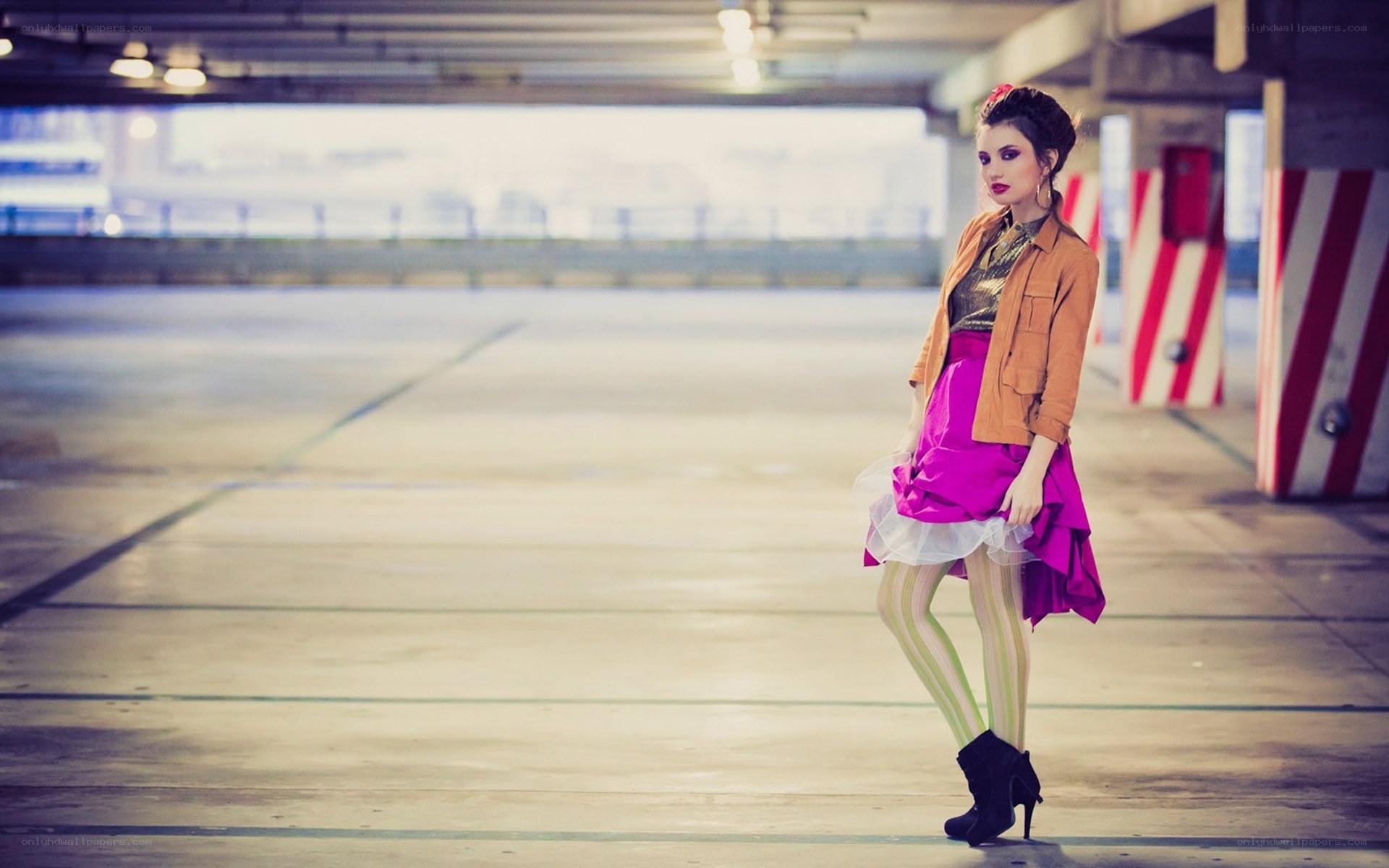 Woman in colorful outfit in parking garage