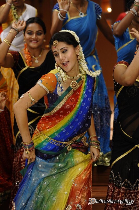 woman in colorful sari dancing