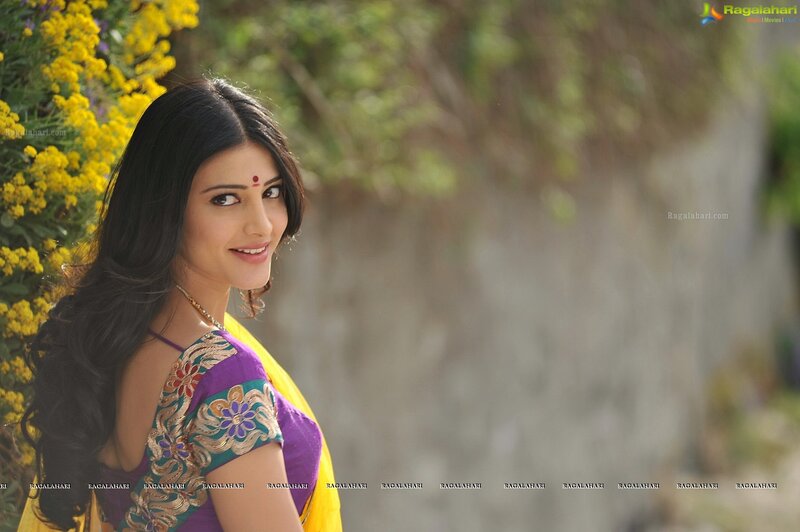 woman in colorful sari smiling