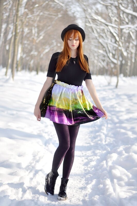 Woman in colorful skirt walking in snow
