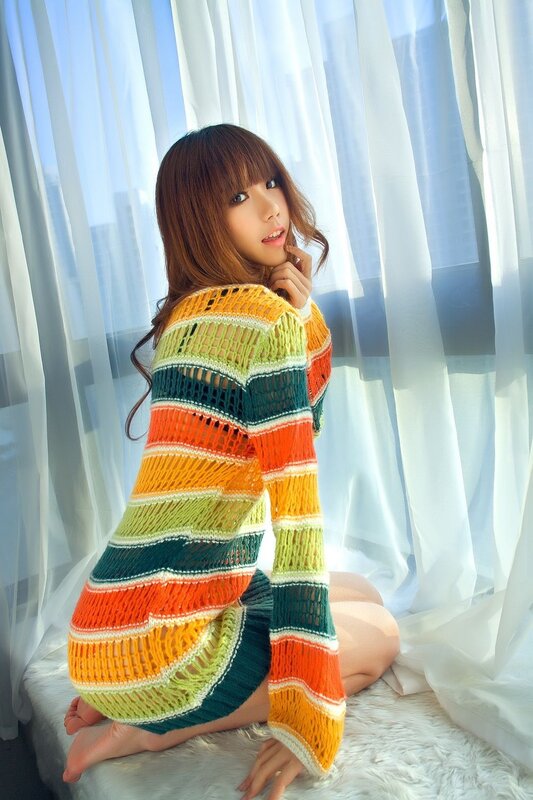 woman in colorful sweater