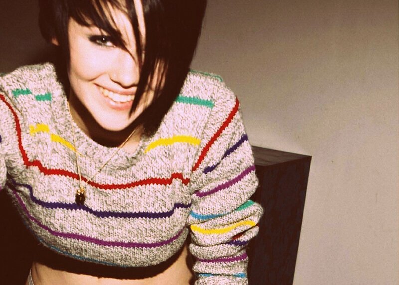 woman in colorful sweater