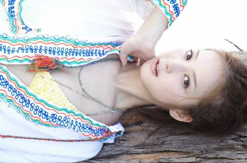woman in colorful top lying down