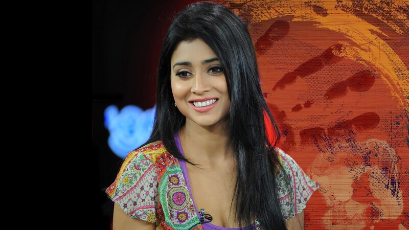 woman in colorful top smiling