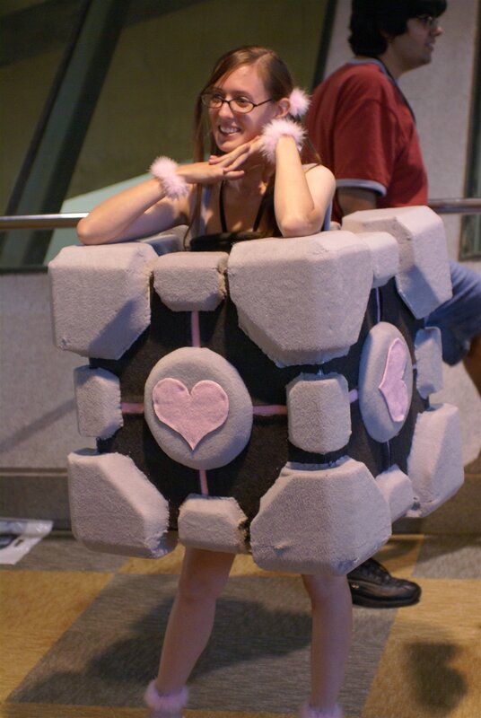 Woman in Companion Cube costume