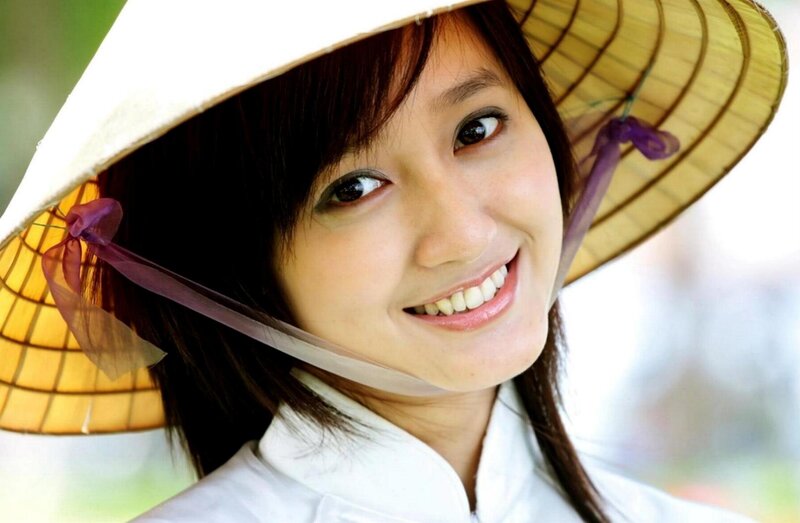 Woman in Conical Hat — White, Cheerful