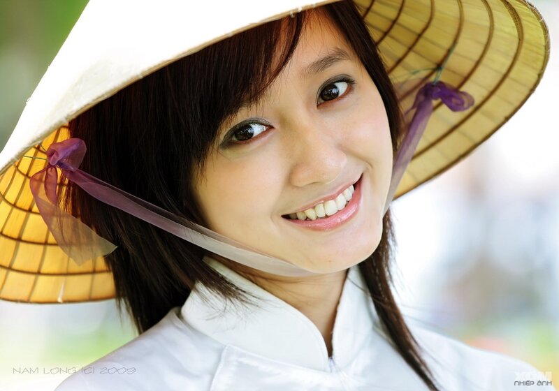 Woman in Conical Hat — White, Smiling