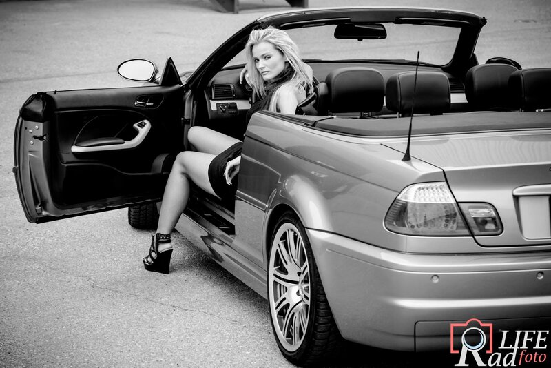 Woman in Convertible Car — Black, Dramatic, Photograph