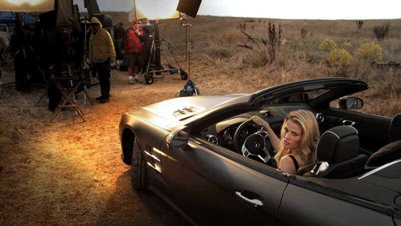 Woman in convertible car on set