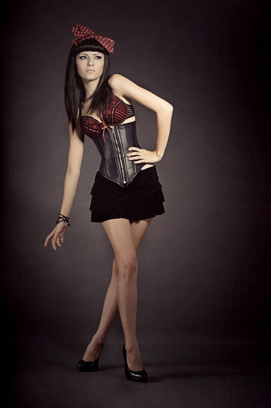 woman in corset and bow