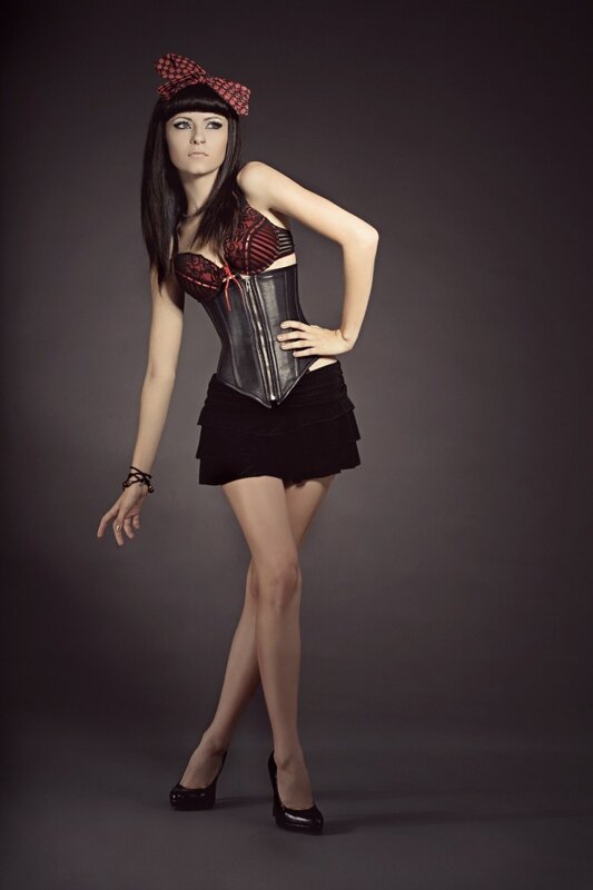 woman in corset and bow
