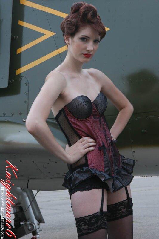 Woman in corset near airplane
