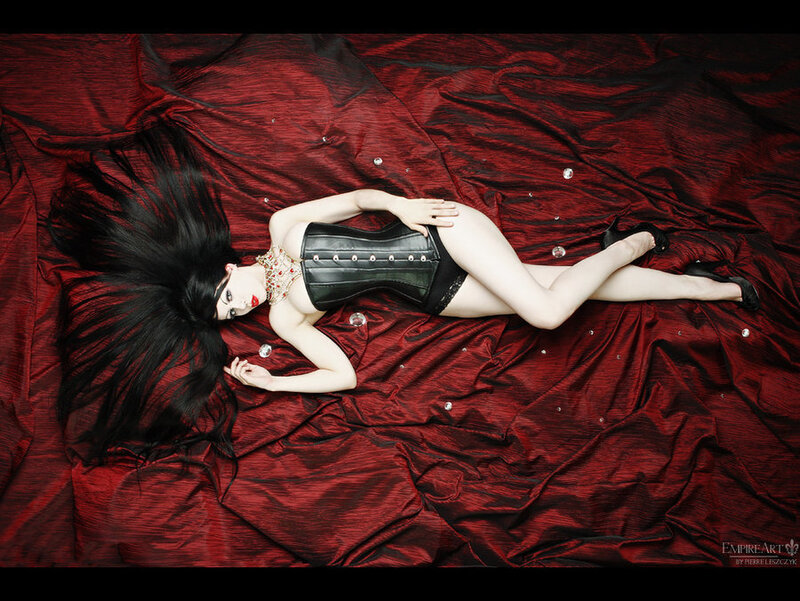 woman in corset on red fabric