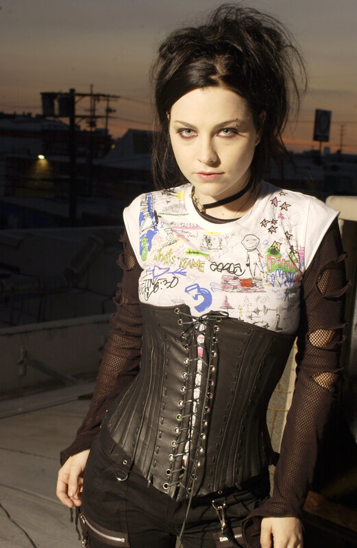 woman in corset on rooftop