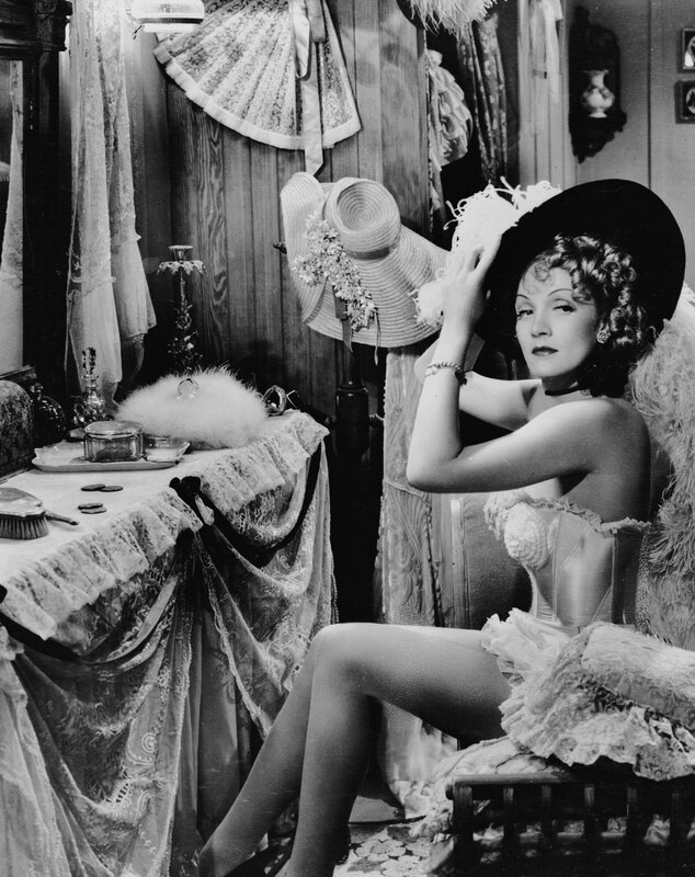 woman in corset with hats