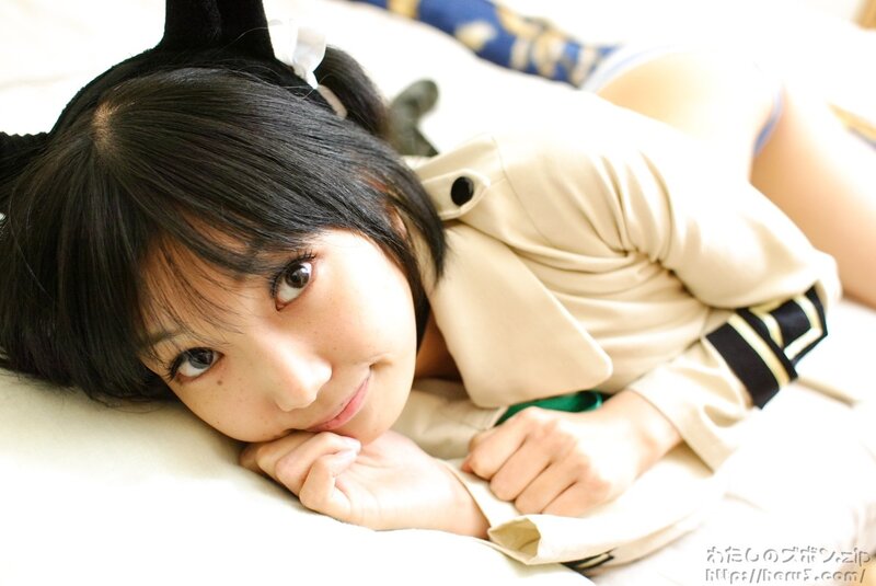 woman in cosplay lying on bed