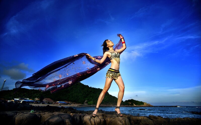 Woman in Costume on Beach