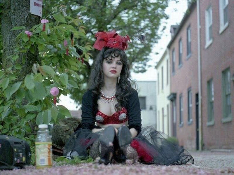 Woman in Costume Sitting — Red