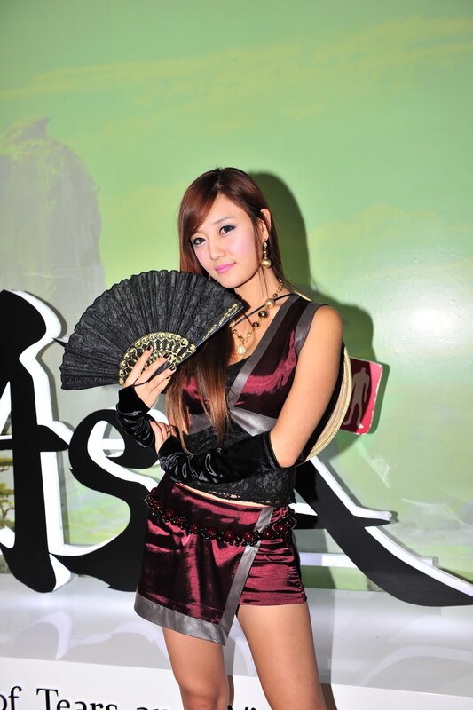 woman in costume with fan