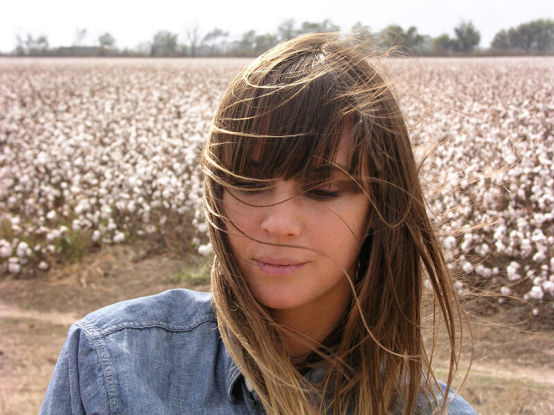 Woman in cotton field