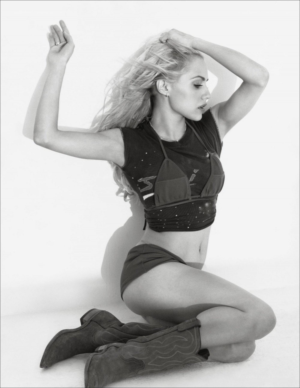 woman in cowboy boots posing