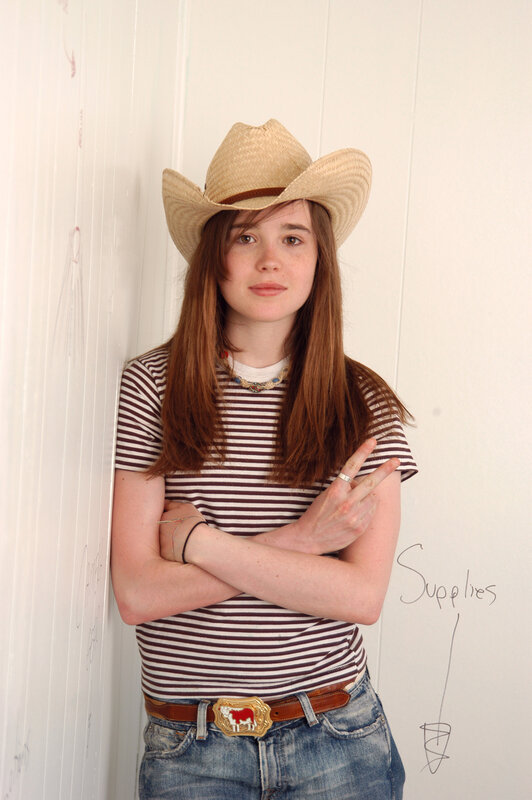 woman in cowboy hat and striped shirt