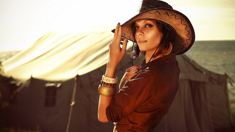 woman in cowboy hat at camp