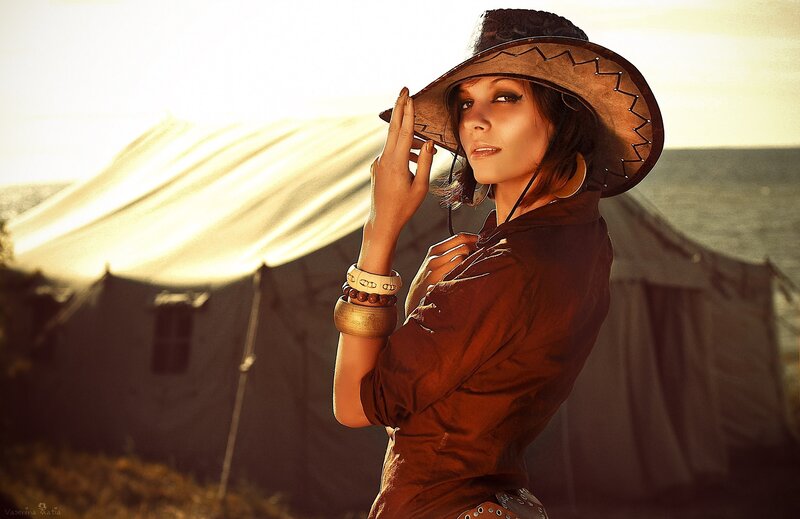 woman in cowboy hat at camp