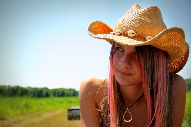 woman in cowboy hat outdoors